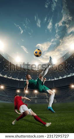 Dynamics. Two male sportsmen, football players in motion during competition, playing at 3D openair stadium, kicking ball. Concept of professional sport, championship, game, achievement