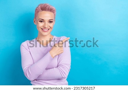 Photo portrait of pretty girl pink dyed hair direct index finger empty space information news isolated blue color background