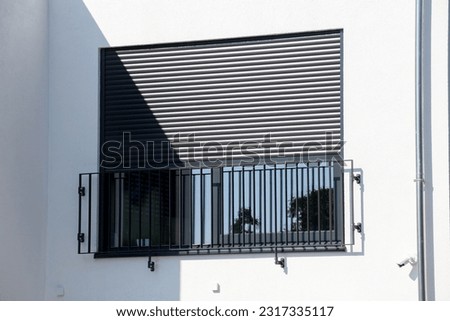 Electric aluminium roller shutter on a new residential building Royalty-Free Stock Photo #2317335117