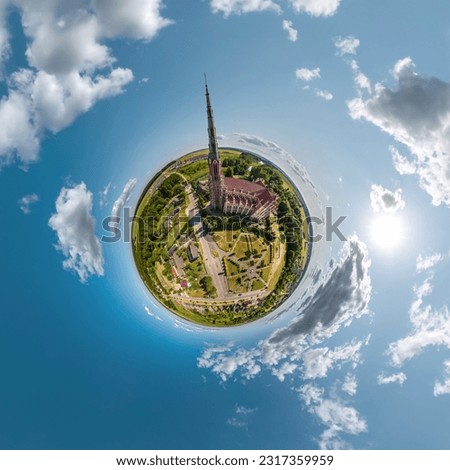 little planet transformation of spherical panorama 360 degrees overlooking church in center of globe in blue sky. Spherical abstract aerial view with curvature of space. Royalty-Free Stock Photo #2317359959