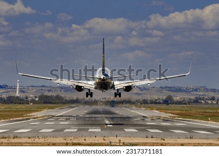 plane landing at destination airport Royalty-Free Stock Photo #2317371181