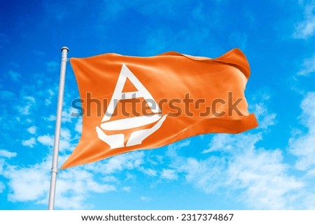 Antarctica flag waving in the wind, blue sky background