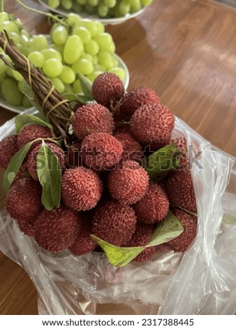 Lychee, summer leaves, Amphawa. There are thorns but not sharp. sweet and sour taste Royalty-Free Stock Photo #2317388445