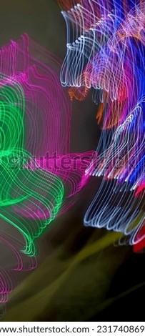Blue pink and green shiny wavy ribbon on a dark background. Simulation of galaxy light motion of stars in dark background, future energy and data technology of cyber programming concept in blue theme.