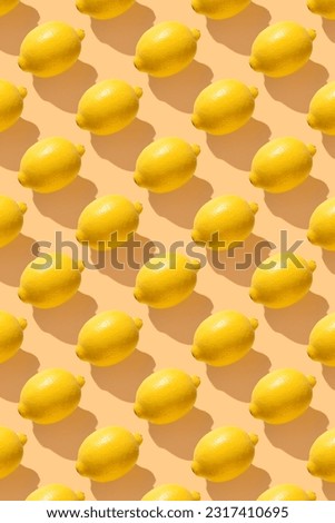 Lemon on yellow pastel soft color with long shadows. Minimal healthy organic food concept. Citrus fruits. Flat lay, top view