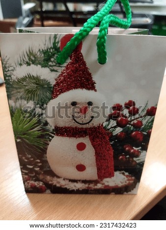 Christmas present bag with snowman