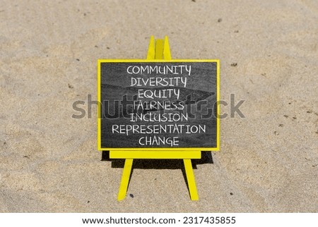 Diversity inclusion symbol. Concept words Community Diversity Equity Fairness Inclusion Representation Change on blackboard on a beautiful sand background. Diversity equity inclusion concept.