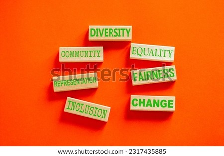 Diversity inclusion symbol. Concept words Community Diversity Equality Fairness Inclusion Representation Change on wooden block. Beautiful orange background. Diversity equality inclusion concept.
