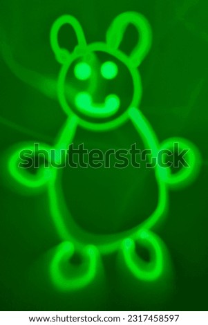 Funny picture of a bear on a green background