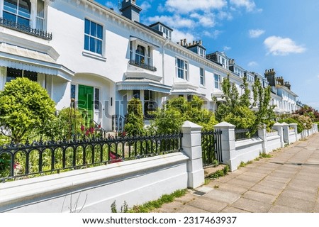 A view along a Victorian terrace In Brighton, UK in summertime Royalty-Free Stock Photo #2317463937