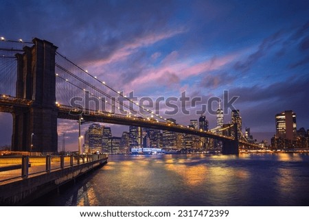 View on Brooklyn bridge and Manhattan at dusk