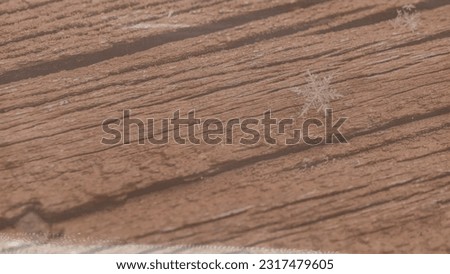Background image of weathered wooden deck rail with single snowflake for Graphic resources template