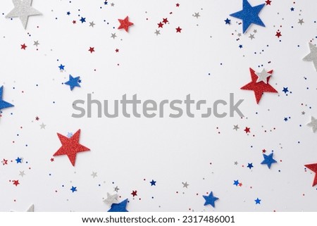 Public holiday in USA concept. High angle view photo of empty space surrounded by red, white and blue star-shaped confetti on white isolated background with copy-space Royalty-Free Stock Photo #2317486001
