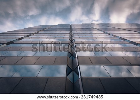 Evening sky reflecting in modern glass architecture at 250 West Pratt Street, in Baltimore, Maryland.