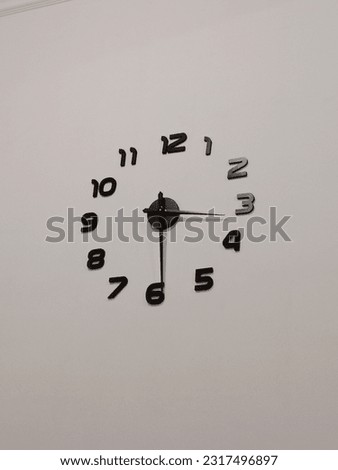 photo of a wall clock hanging on the wall