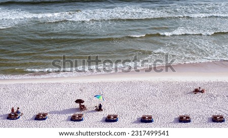 Beach and Ocean with Umbrellas and benches