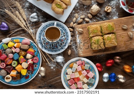 Turkish Coffee in the Colorful Eid Candy and Chocolate, Traditional Ottoman Cuisine Desserts, Turkish Delight and Baklava Photo, Üsküdar Istanbul, Turkiye Royalty-Free Stock Photo #2317502191