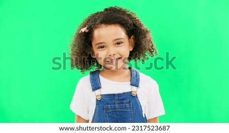 Happy, little girl and green screen with smile of cute innocent child isolated against a studio background. Portrait of adorable female kid smiling with teeth for childhood youth on chromakey mockup
