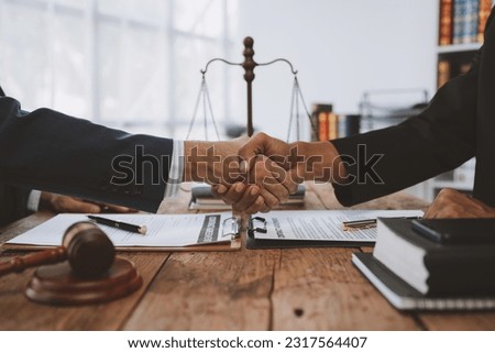 Lawyers join hands with business people to sign a partnership agreement on cooperation agreements related to joint financing of financial business. concept of justice, real estate