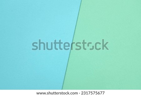 two tone green pastel and blue pastel paper color for background. two color paper with overlay on the floor And split half of the image. background.top view with place for text Royalty-Free Stock Photo #2317575677