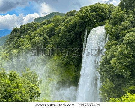 View of Cascata delle Marmore (Marmore Falls), a man-made waterfall created by the ancient Romans located near Terni in Umbria region, Italy. The waters are used to fuel an hydroelectric power plant Royalty-Free Stock Photo #2317597421