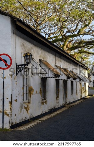 Galle Fort streets Colonial style building and paved road and no turning road sign.
