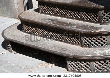 historic outdoor stairs made of cast iron with rounded corners