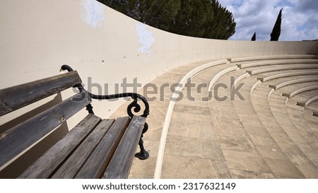 Corner of a bench in an amphitheater, offering a peaceful spot for relaxation Royalty-Free Stock Photo #2317632149