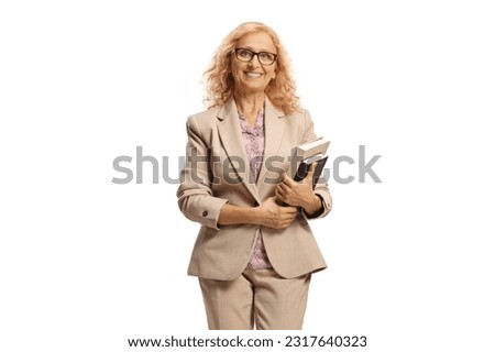 Female teacher holding books and smiling isolated on white background