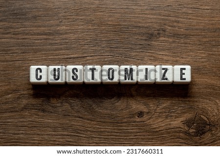 Customize - word concept on building blocks, text, letters Royalty-Free Stock Photo #2317660311