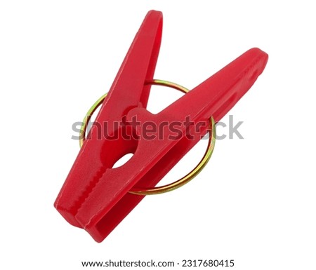 Red plastic clothespin isolated on white background with clipping path. Royalty-Free Stock Photo #2317680415