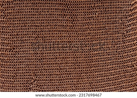 Chain mail background. bronze color. Interesting intricate texture