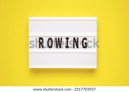 The word rowing on lightbox isolated yellow background.
