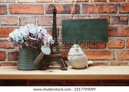 Empty wooden hanging on old brick wall background with home decoration on wooden shelve