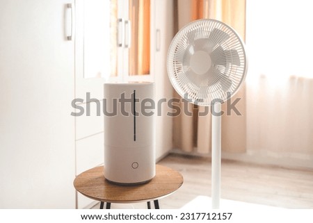 Air freshener and electric fan in the room. Royalty-Free Stock Photo #2317712157