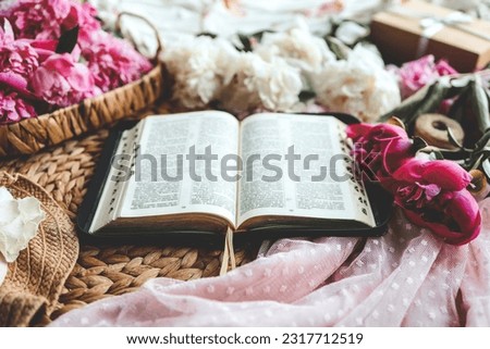 Open bible in home morning interior.