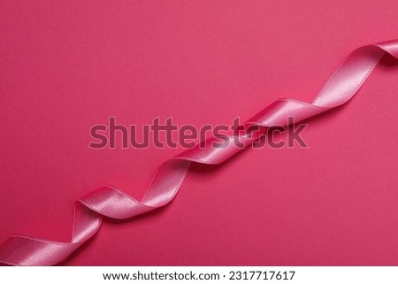 Concept of different ribbons, pink ribbon on pink background