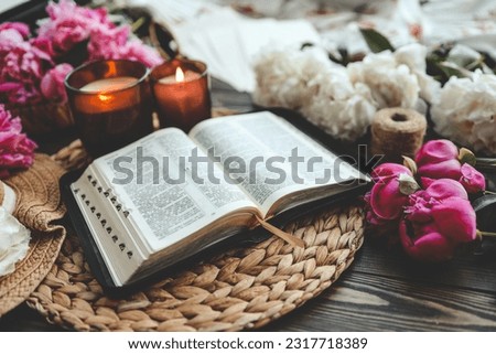 Open bible in home morning interior.