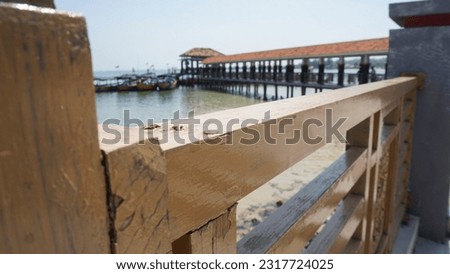 A picture of a bridge on the edge of kartini beach, Indonesia