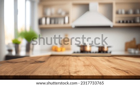 Beautiful empty brown wooden table top and blurred defocused modern kitchen interior background with daylight flare, product montage display. Royalty-Free Stock Photo #2317733765