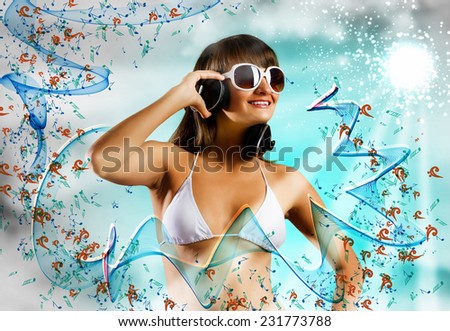 Attractive girl in white bikini and headphones