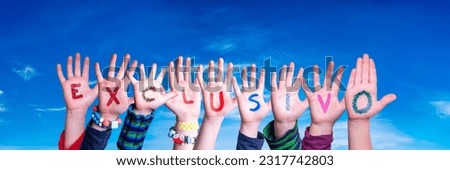 Children Hands Building Colorful Spanish Word Exclusivo means Exclusive. Blue Sky As Background.