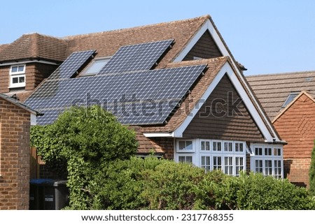 Solar panels fitted to residential properties Royalty-Free Stock Photo #2317768355