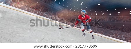 Young man, professional hockey player in red uniform in motion with puck and stick during competition on 3D ice rink, arena. Concept of sport, competition, match, game, action and motion