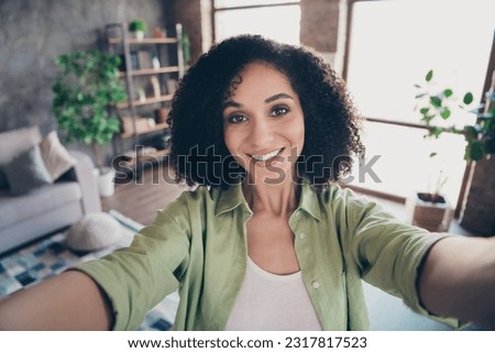 Portrait of friendly positive lovely girl beaming smile take selfie recording video spend free time weekend house inside