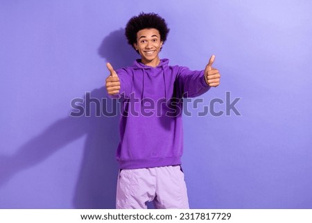 Photo of positive young intern guy worker wearing purple hoodie good job result rate hr agreement isolated on violet color background