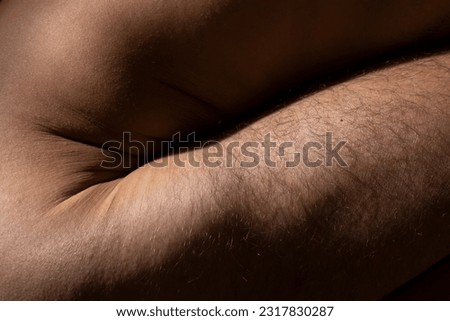 Detailed texture of human skin, close up shot of young male body. Skincare, bodycare, healthcare, hygiene and medicine concept Royalty-Free Stock Photo #2317830287