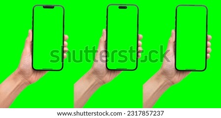 Hand holding the black smart phone with blank screen and modern frameless design in two rotated perspective positions - isolated on white background - Clipping Path