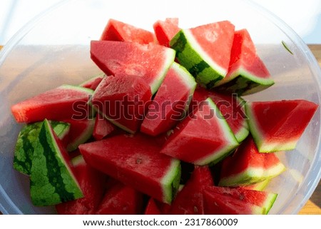 Chopped fresh watermelon served up in a bowl to eat at a party