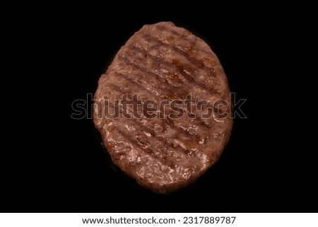 Cutlet with minced beef isolated on a black background.